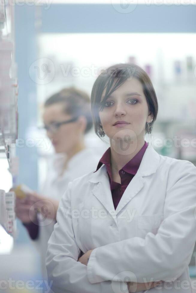 team of pharmacist chemist woman  in pharmacy drugstore photo