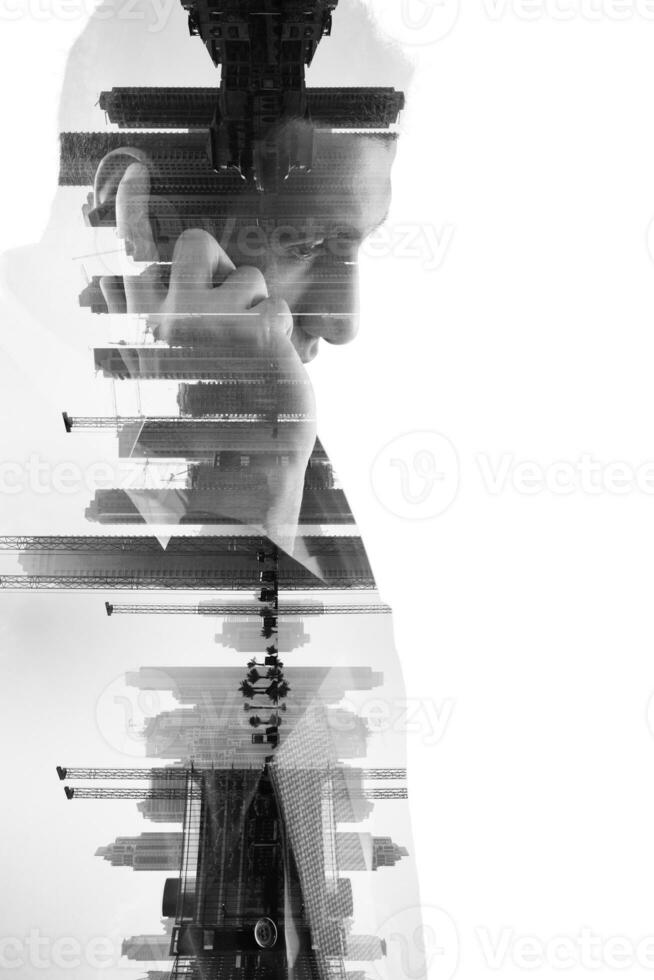 double exposure of business man with  mobile phone and city buildings photo