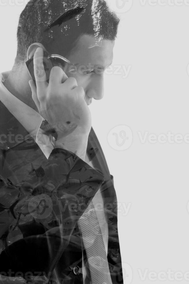 double exposure of business man and ocean fish photo