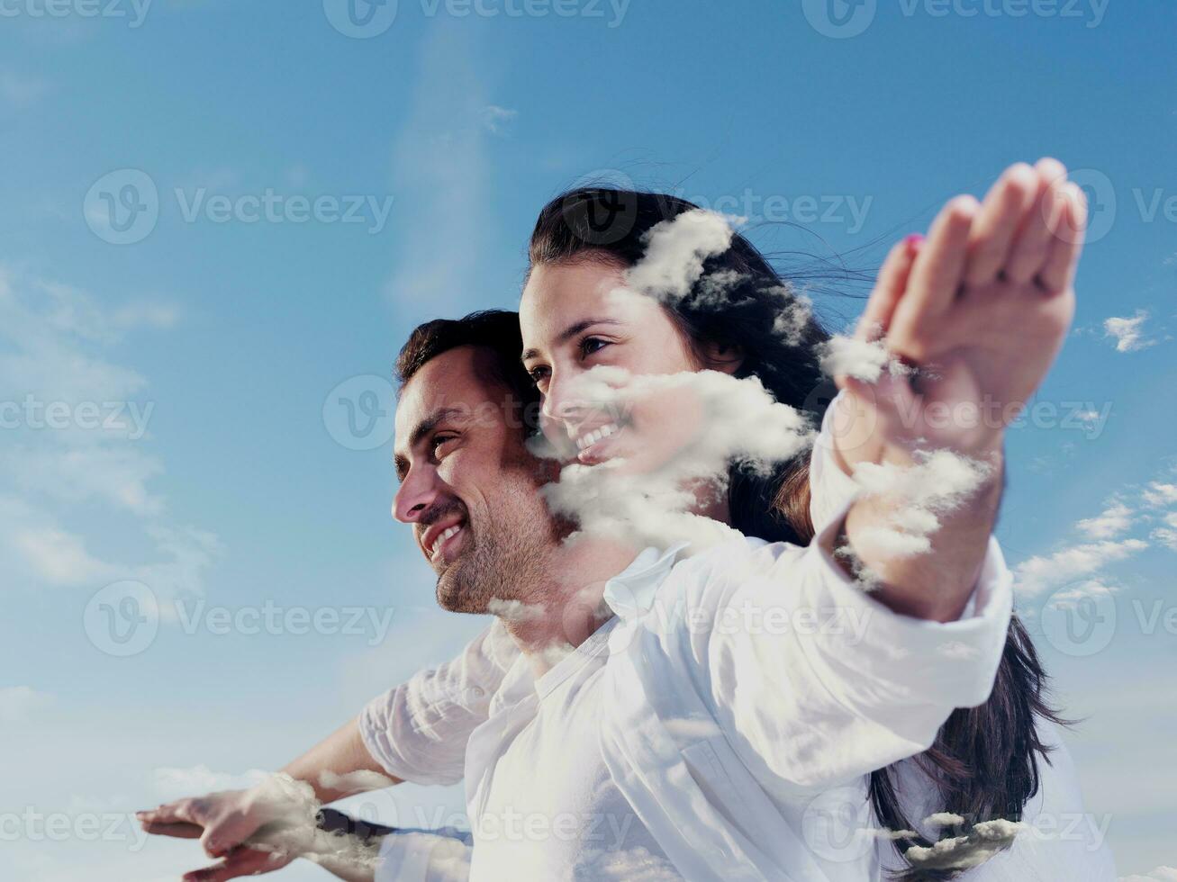 double exposure of young couple  cloudes photo