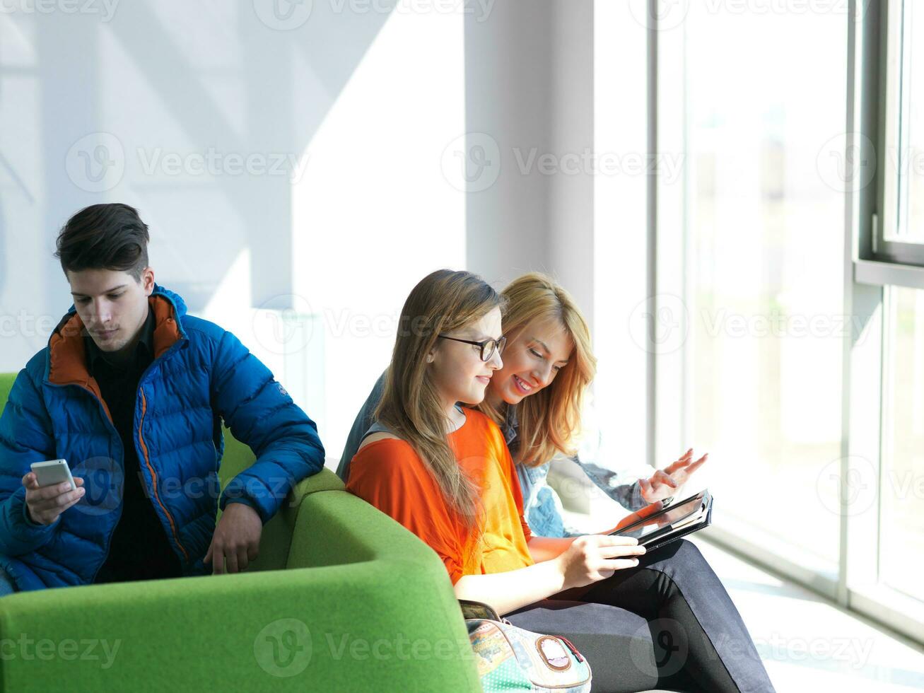 students group working on school  project  together photo