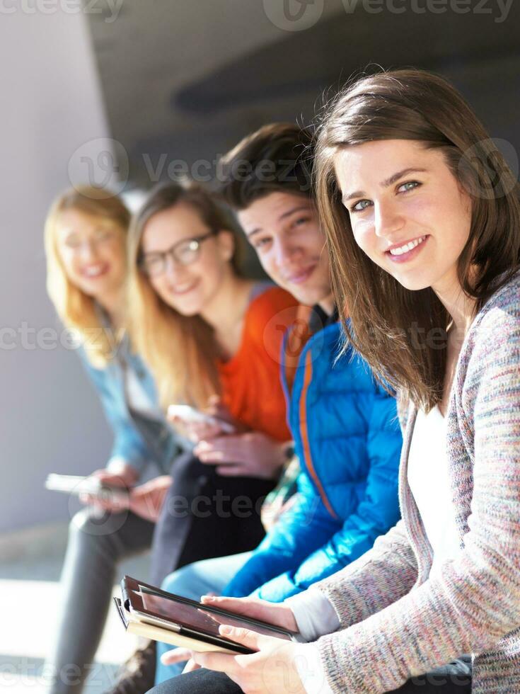 students group working on school  project  together photo