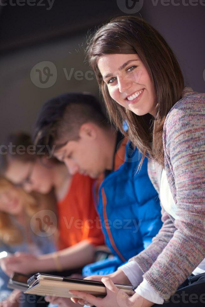 students group working on school  project  together photo