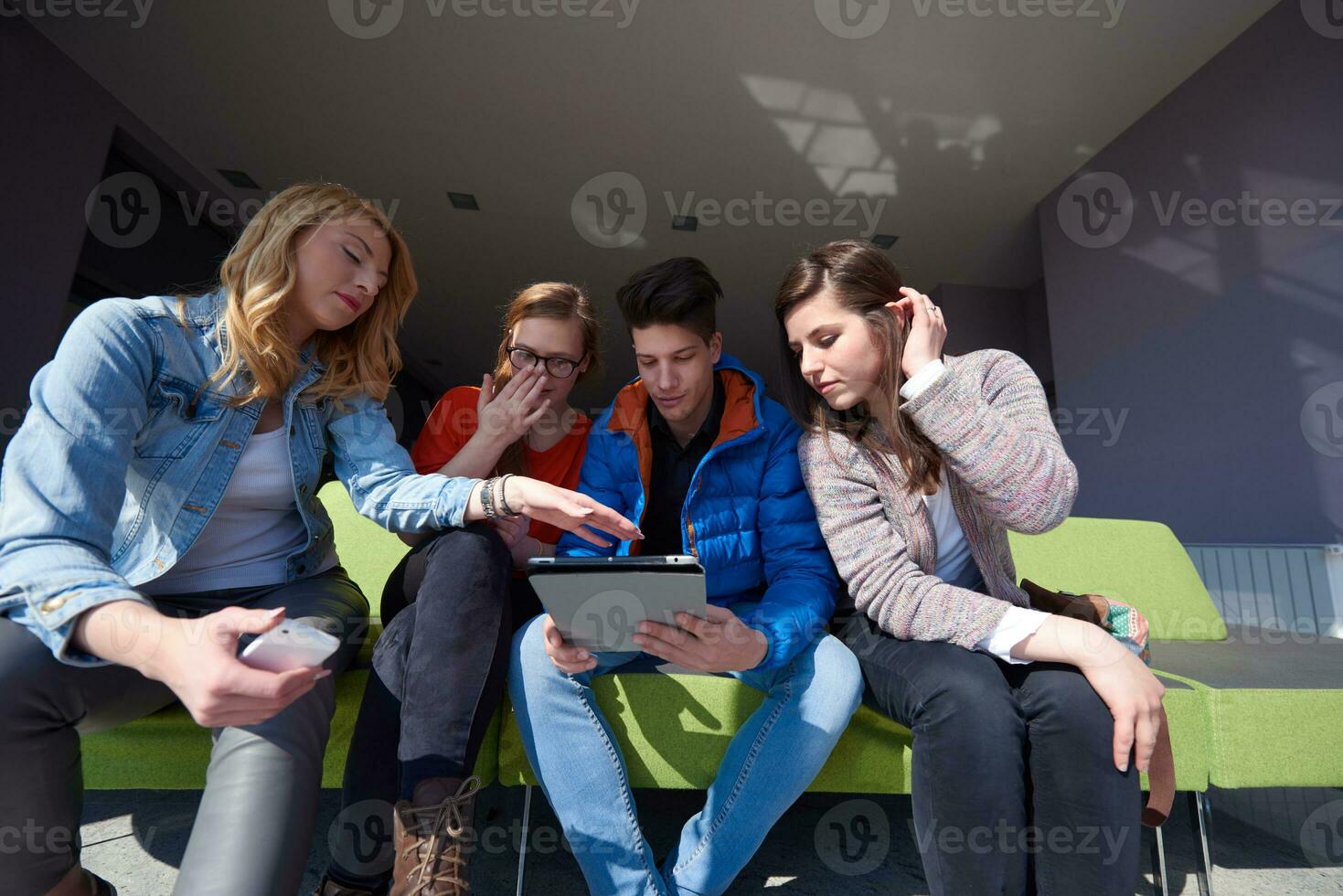 students group working on school  project  together photo