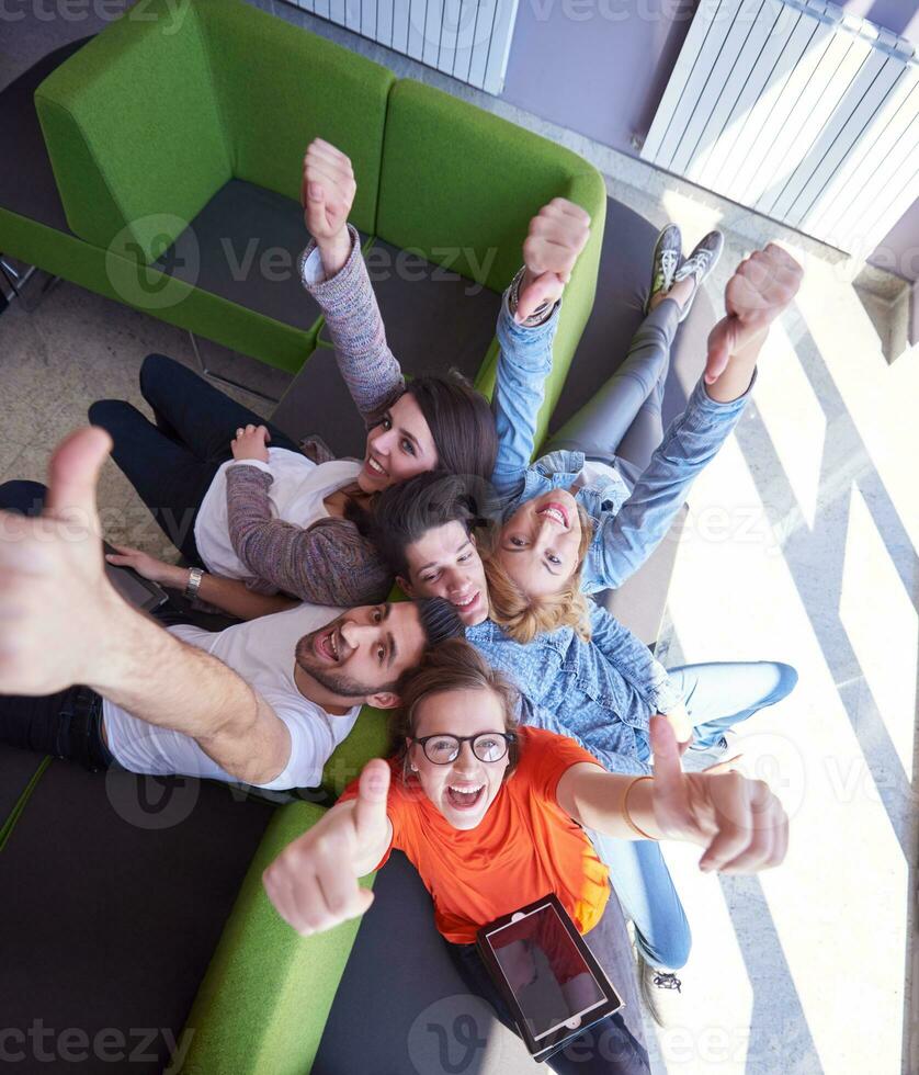students group working on school  project  together photo