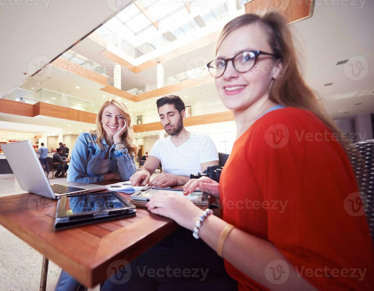 students group working on school  project  together photo