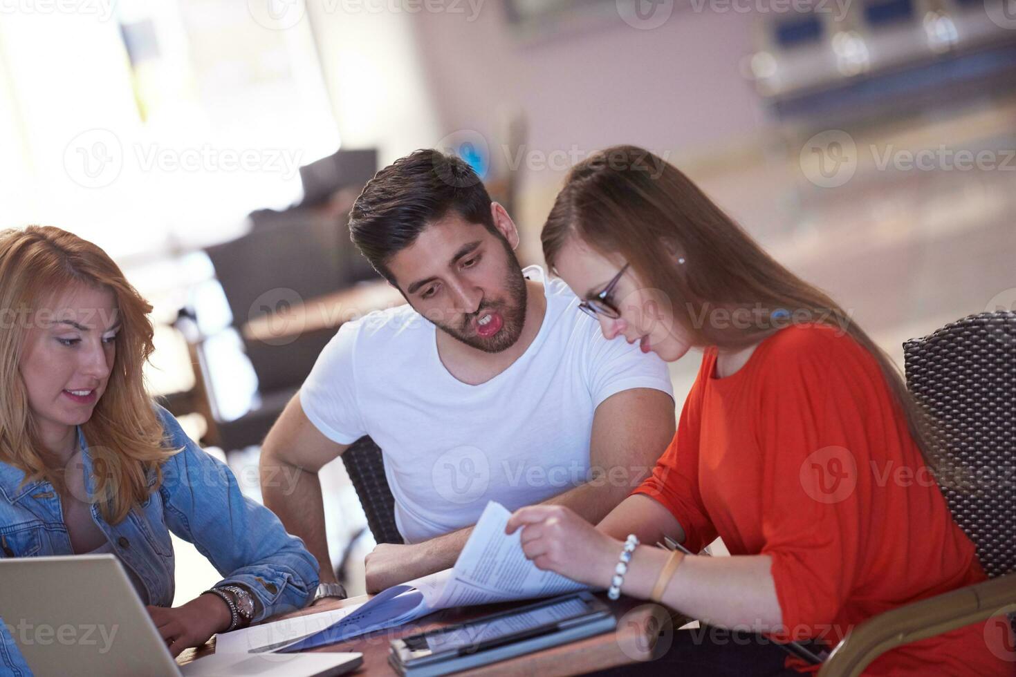 students group working on school  project  together photo