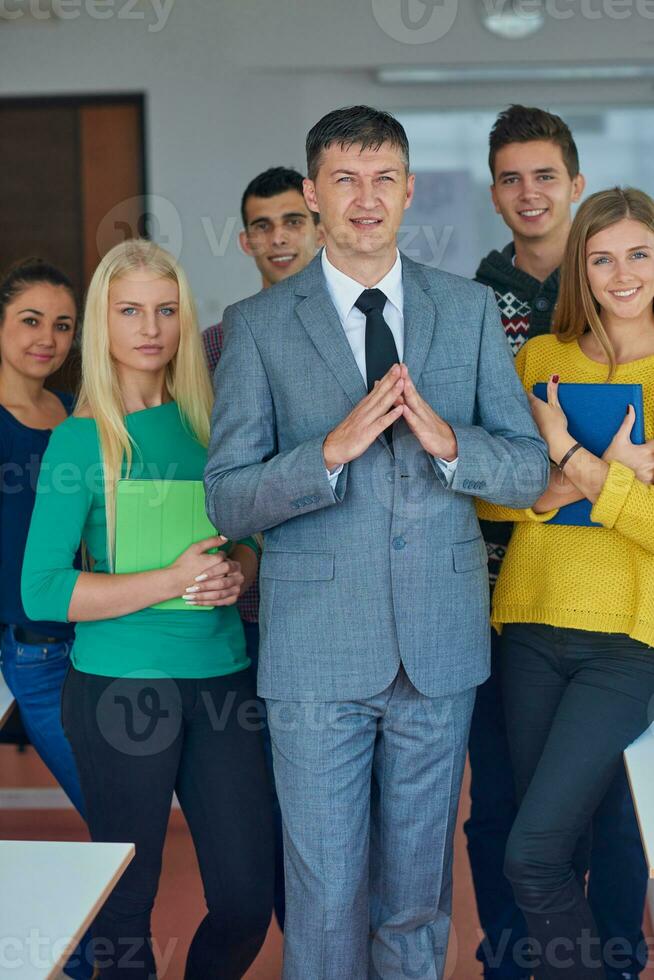 group portrait of teacher with students photo