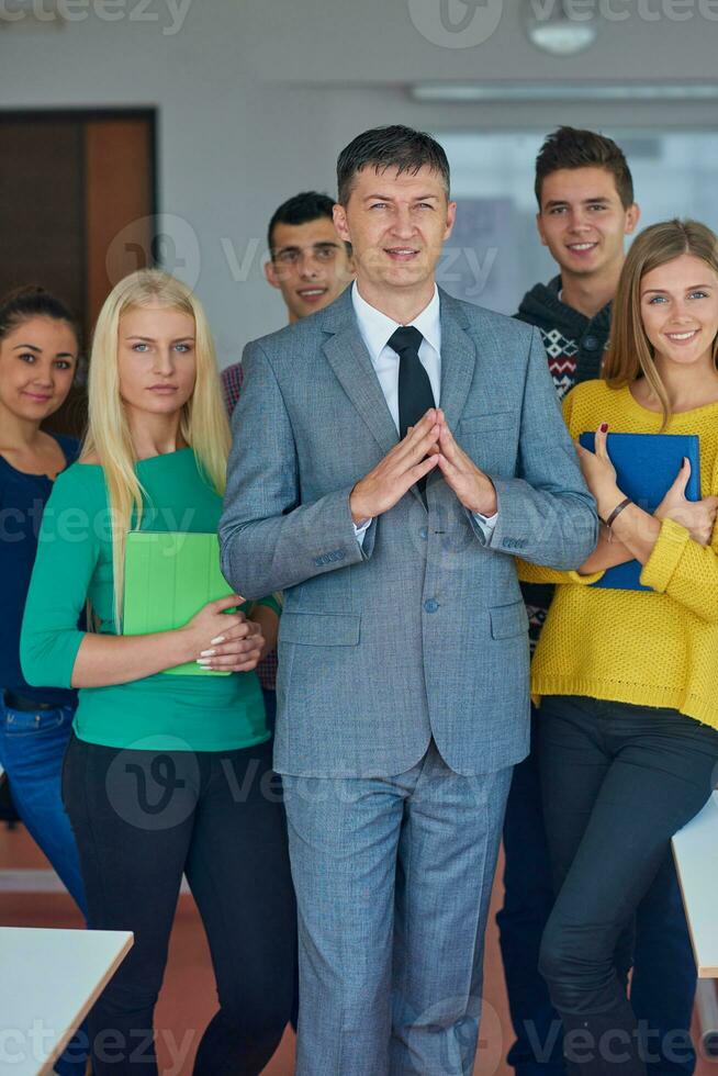 group portrait of teacher with students photo