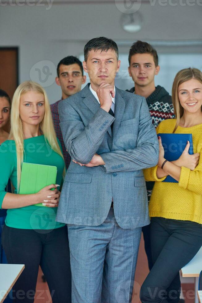 group portrait of teacher with students photo