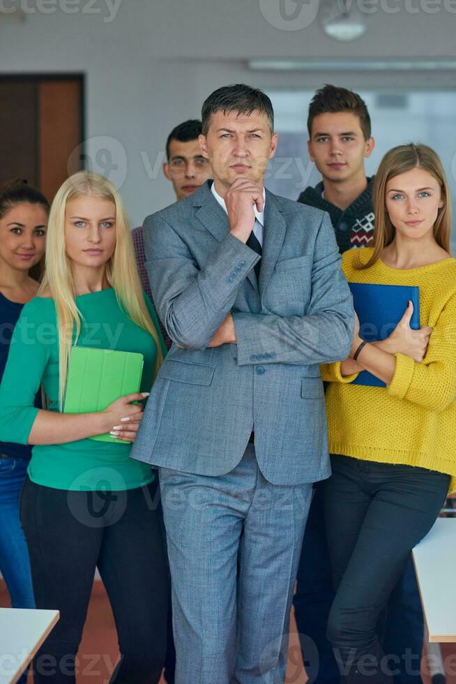 group portrait of teacher with students photo