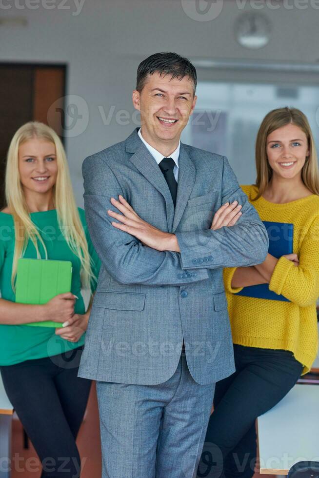 group portrait of teacher with students photo