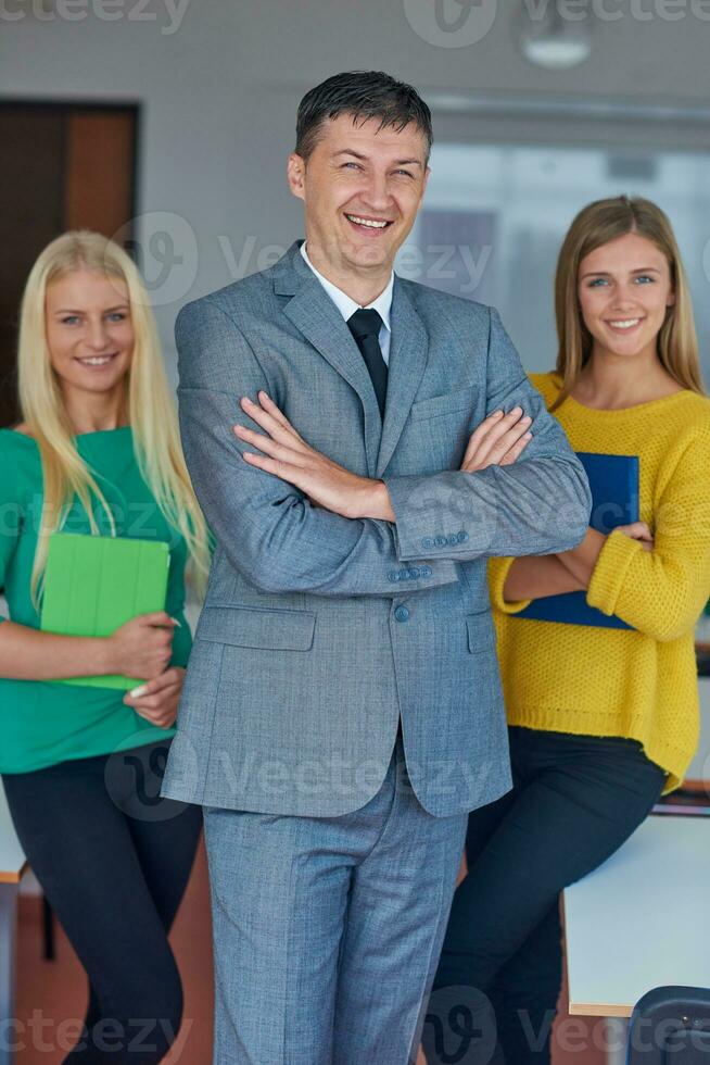 group portrait of teacher with students photo
