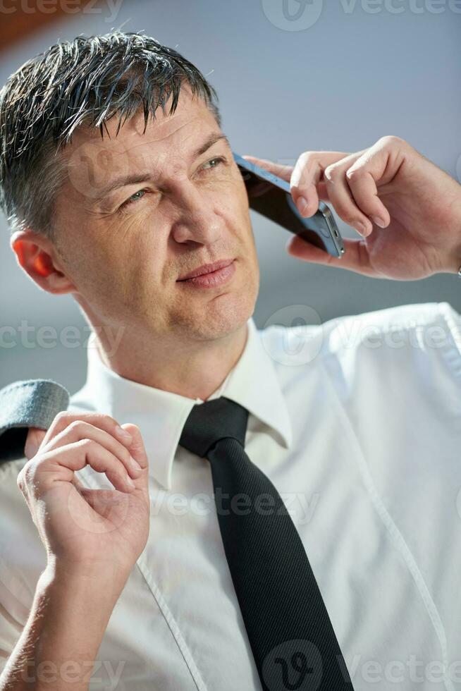 business man using phone photo