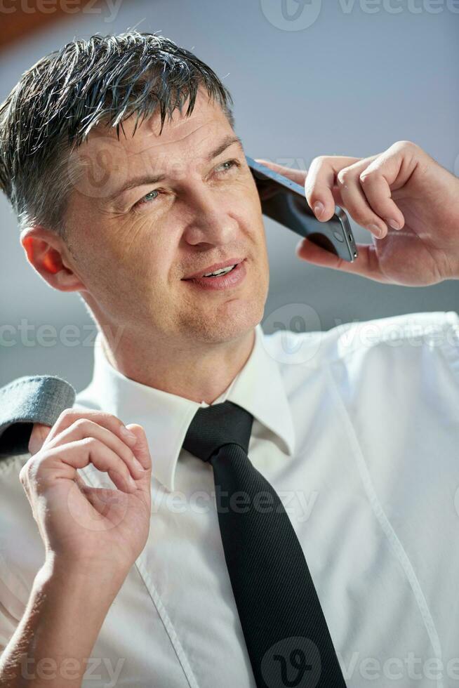 business man using phone photo