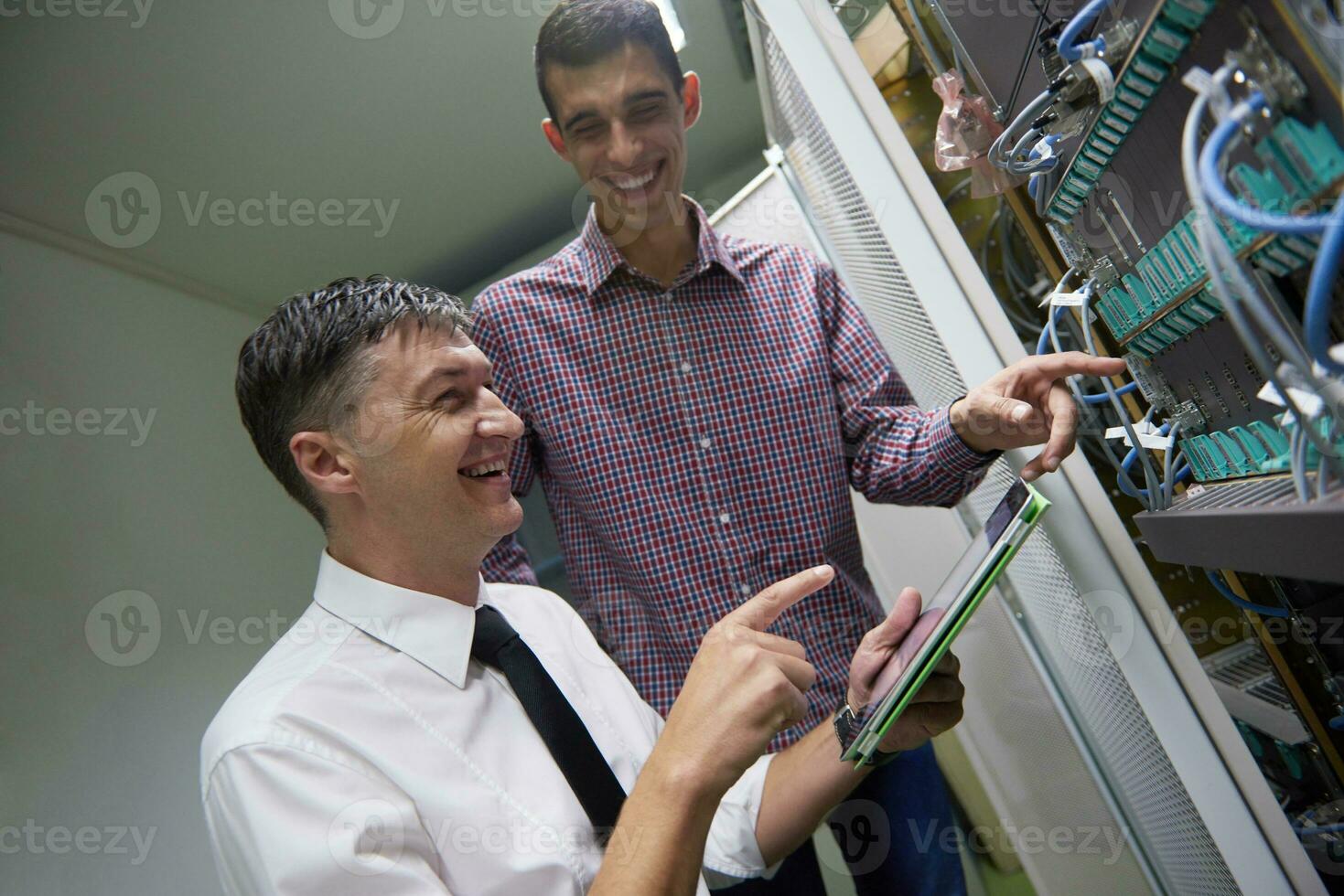 network engineers in server room photo