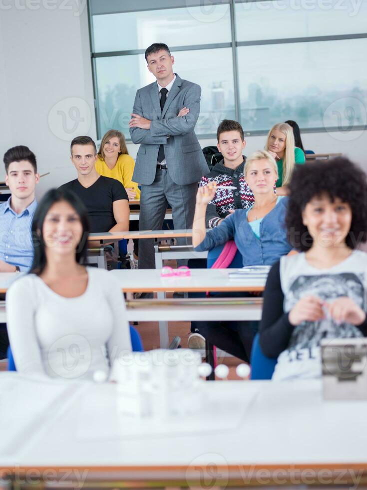 students with teacher  in computer lab classrom photo