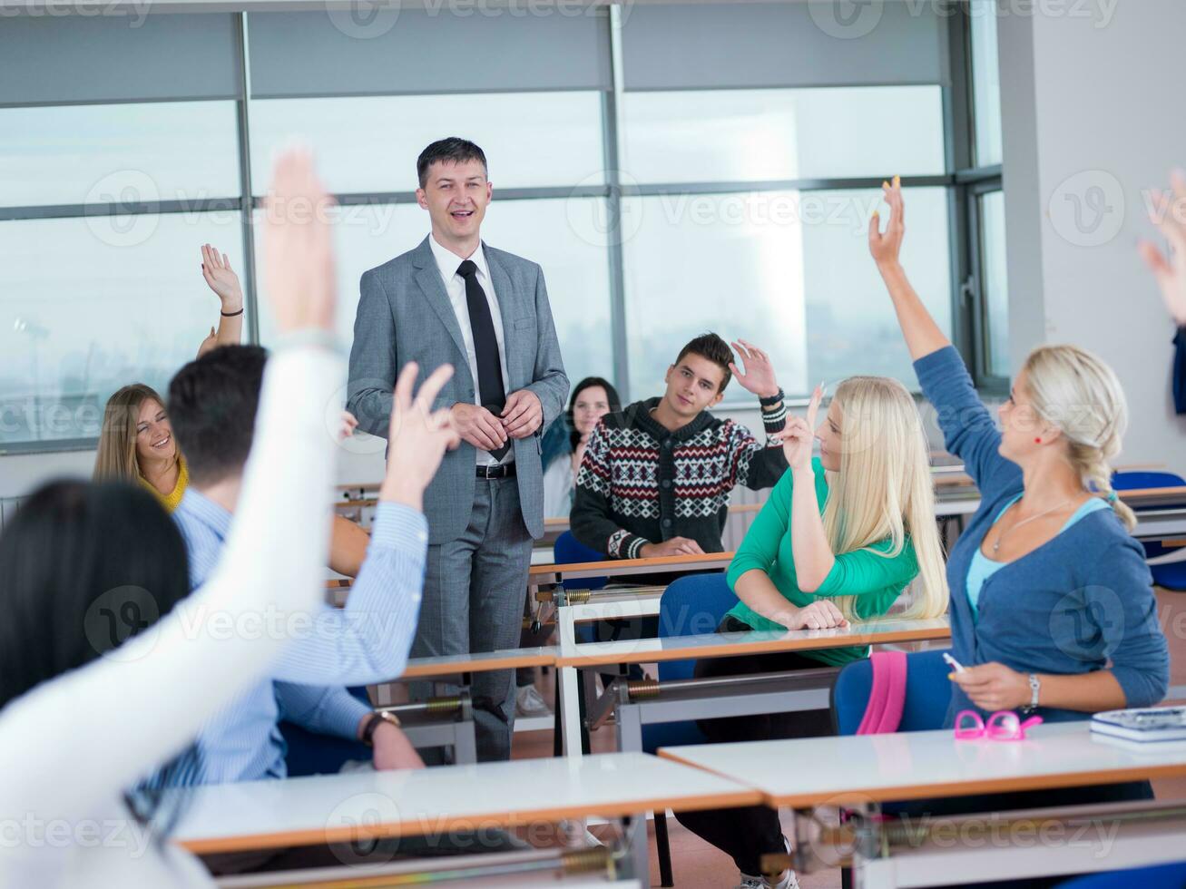 students with teacher  in computer lab classrom photo