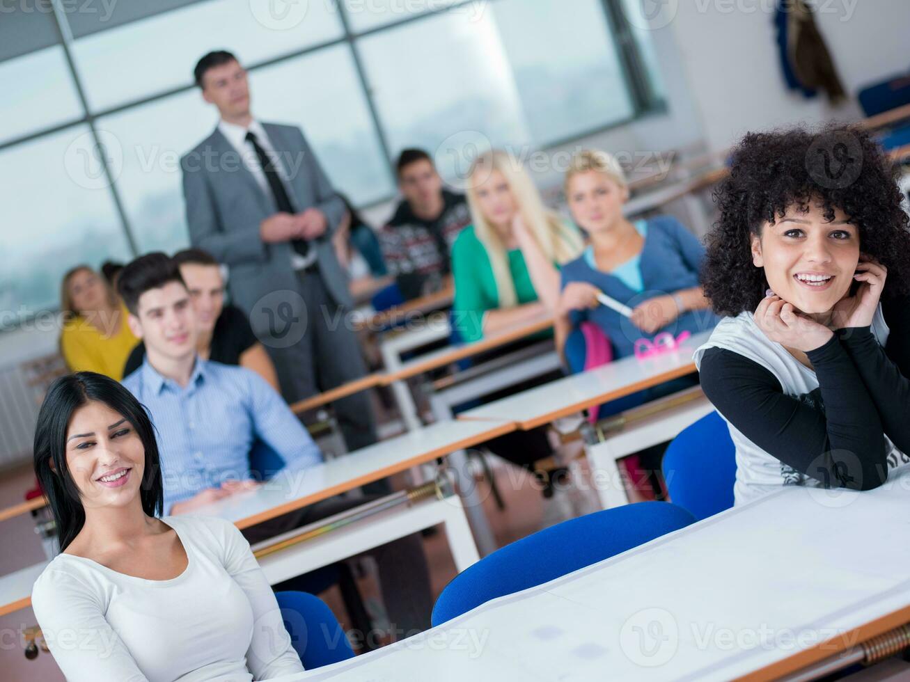 students with teacher  in computer lab classrom photo