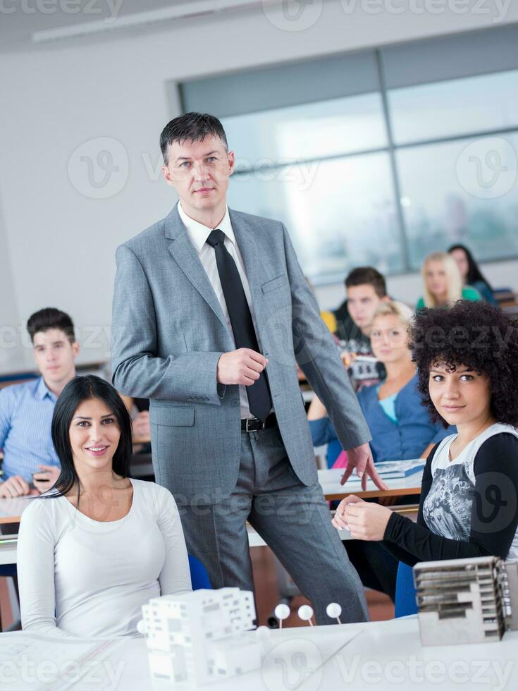 students with teacher  in computer lab classrom photo