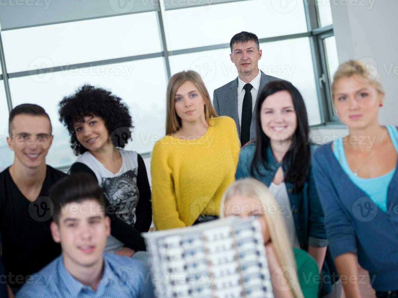 students with teacher  in computer lab classrom photo