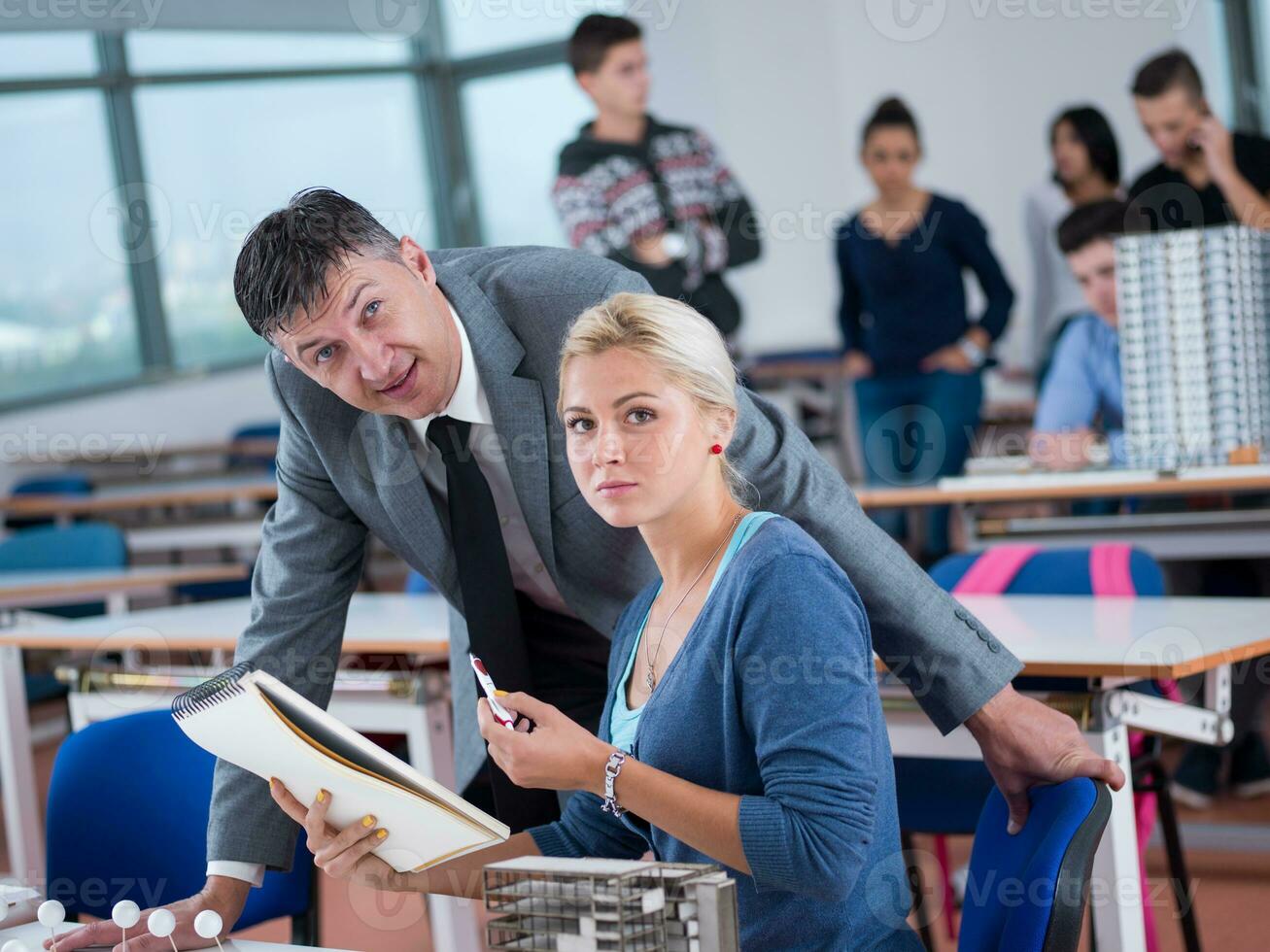 students with teacher  in computer lab classrom photo