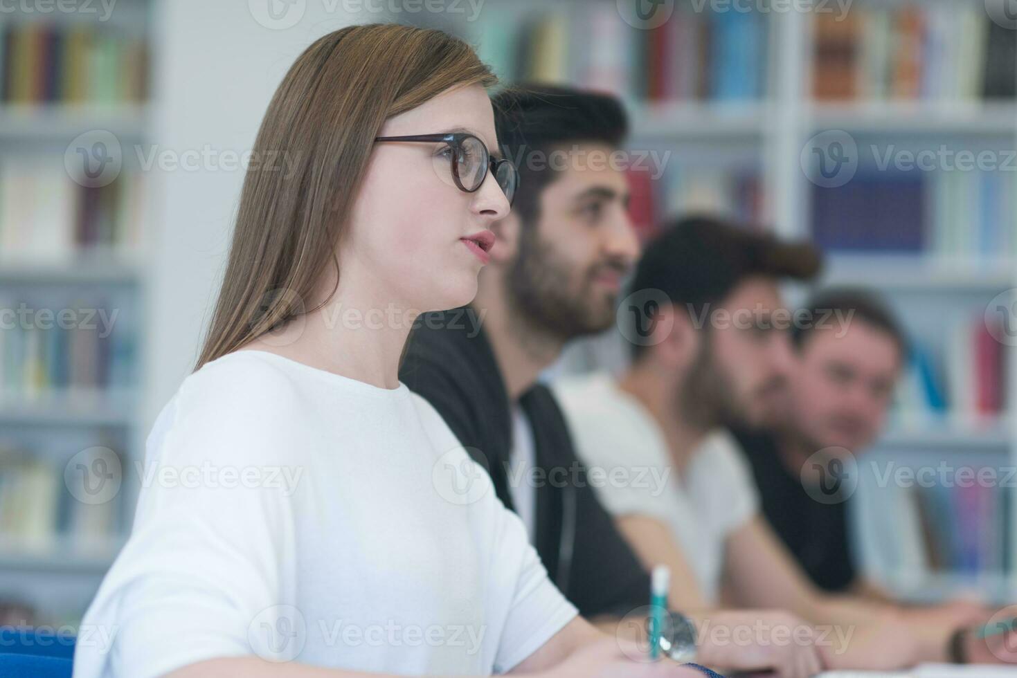 group of students study together in classroom photo
