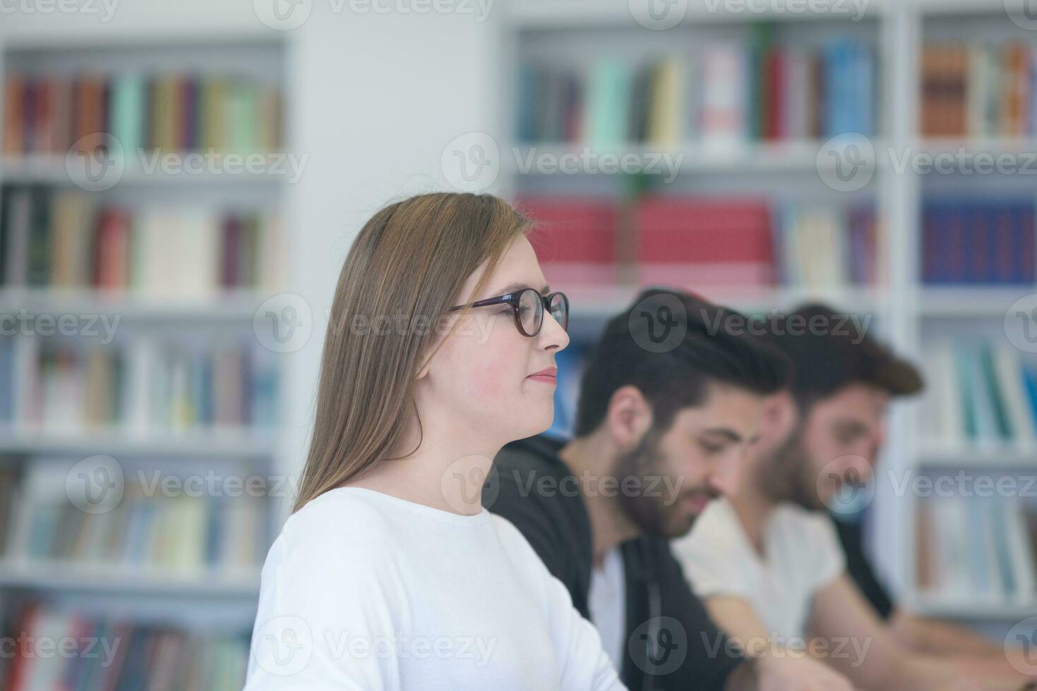 group of students study together in classroom photo