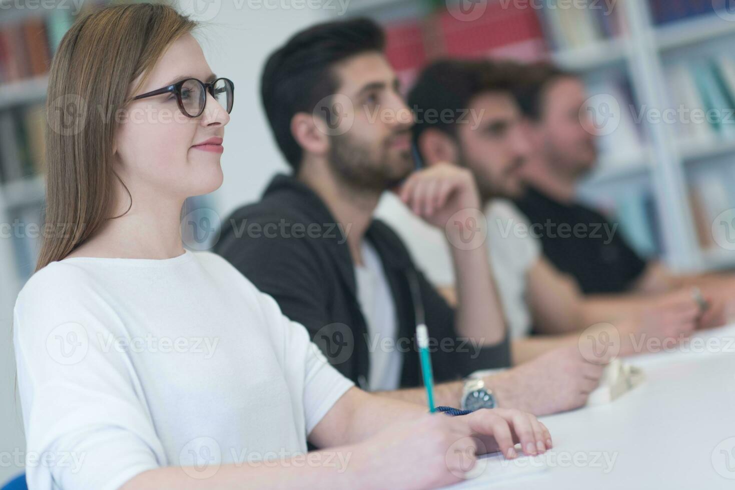 group of students study together in classroom photo