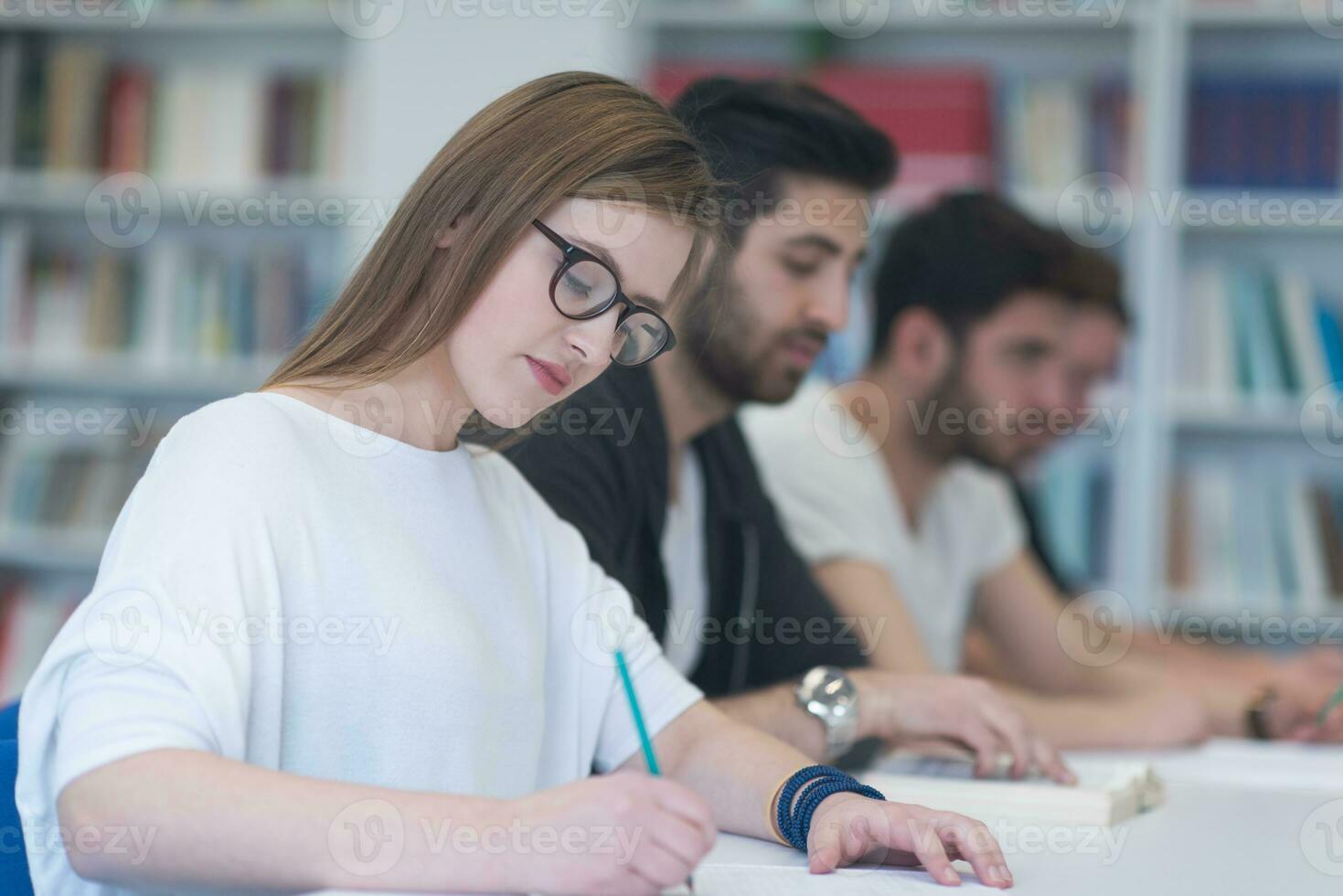 group of students study together in classroom photo