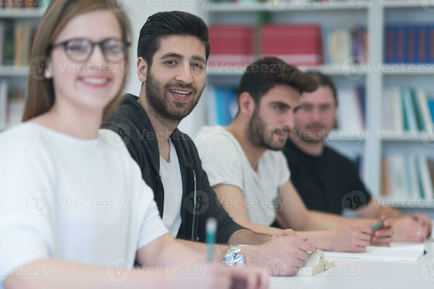 group of students study together in classroom photo