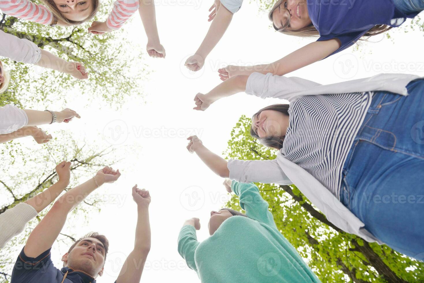 young friends staying together outdoor in the park photo