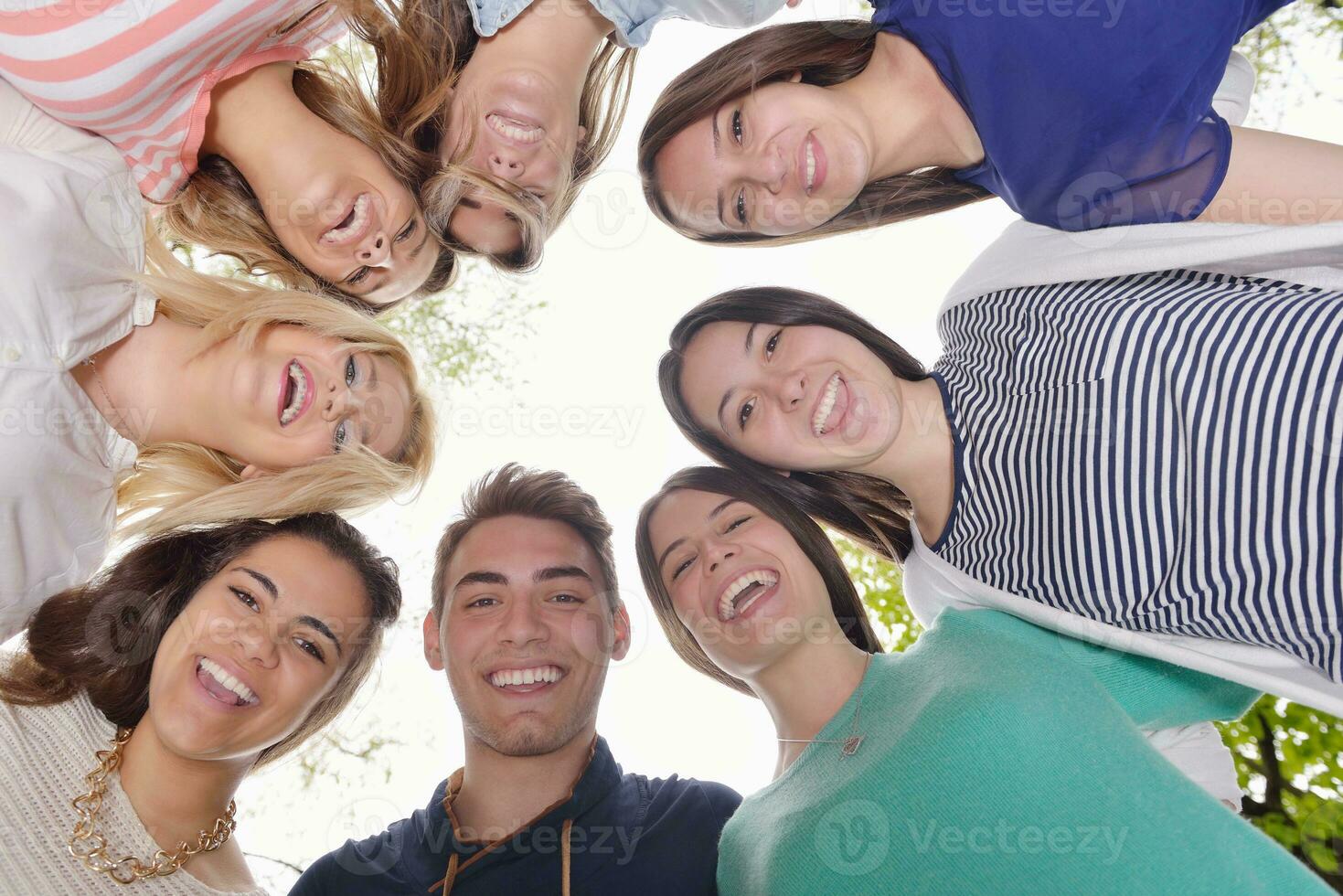 young friends staying together outdoor in the park photo