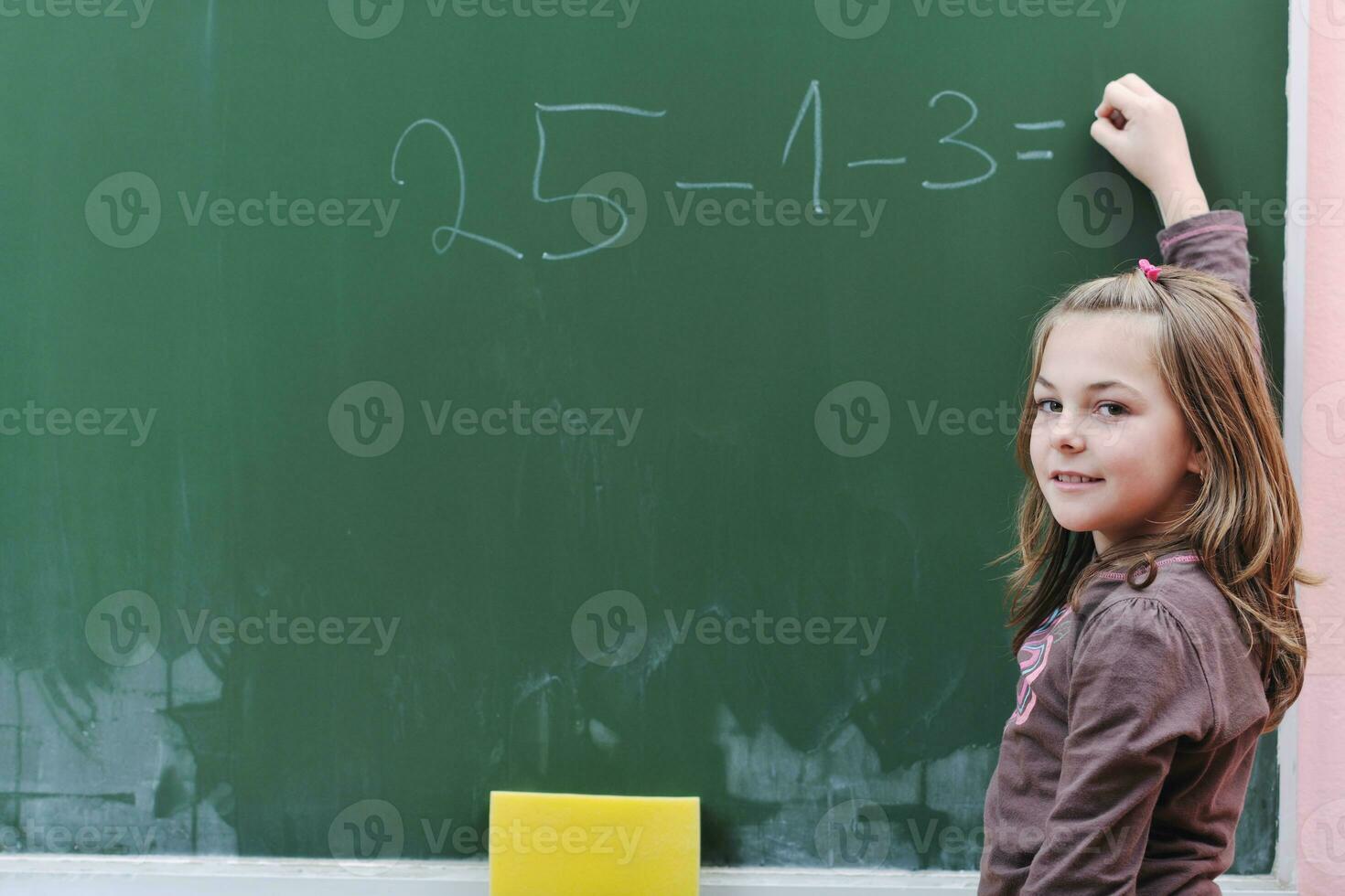 happy school girl on math classes photo