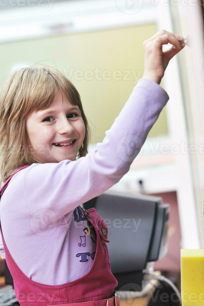 happy school girl on math classes photo