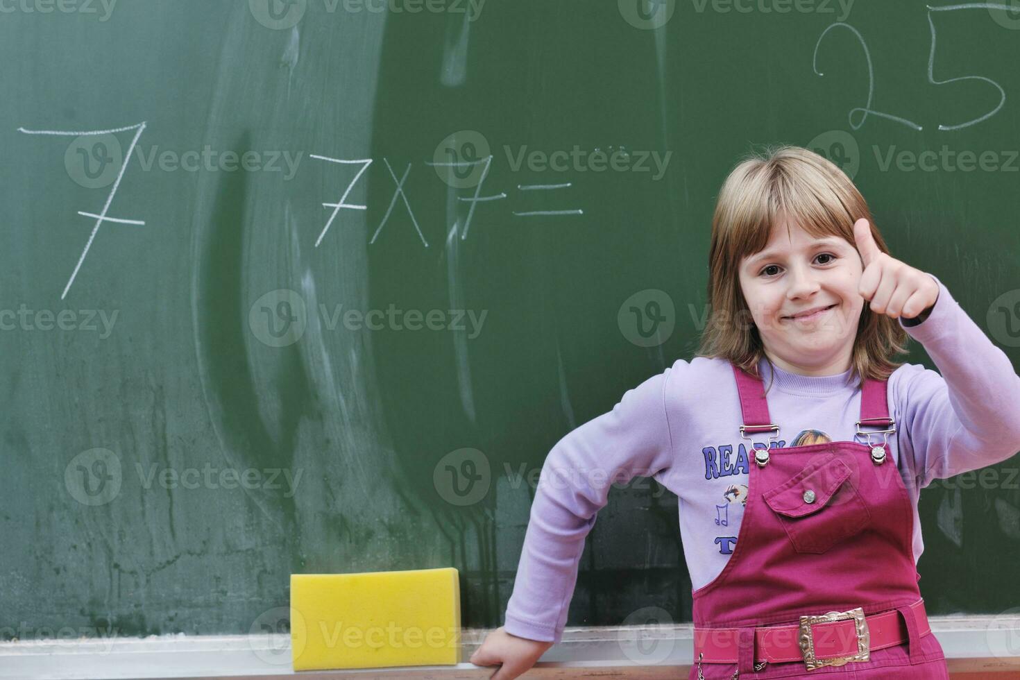 happy school girl on math classes photo