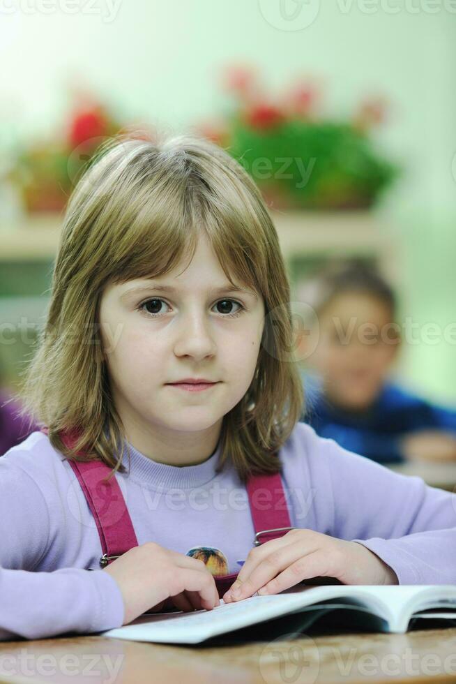 happy child  in schoold have fun and learning leassos photo