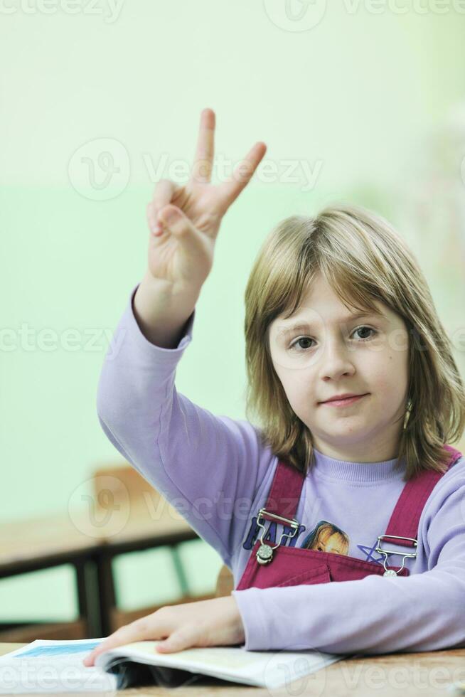 happy child  in schoold have fun and learning leassos photo