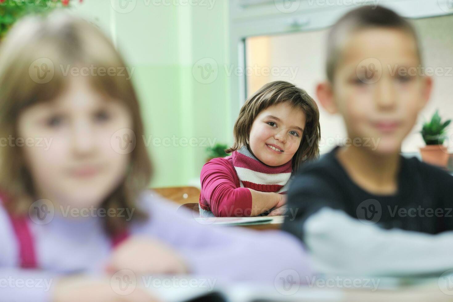 happy child  in schoold have fun and learning leassos photo