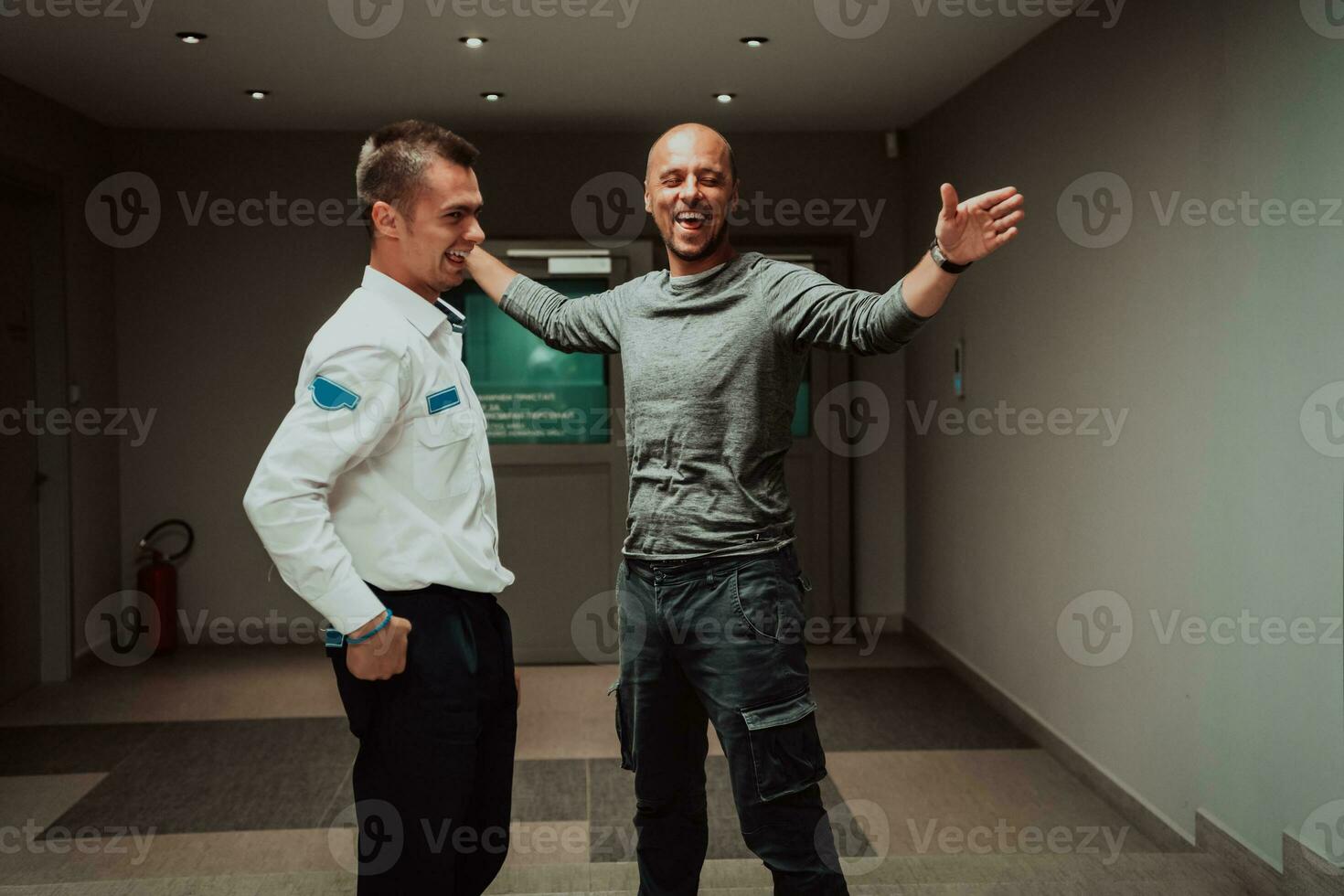 Security guard making body searching procedure on man for finding hidden objects before entering in treasury department photo