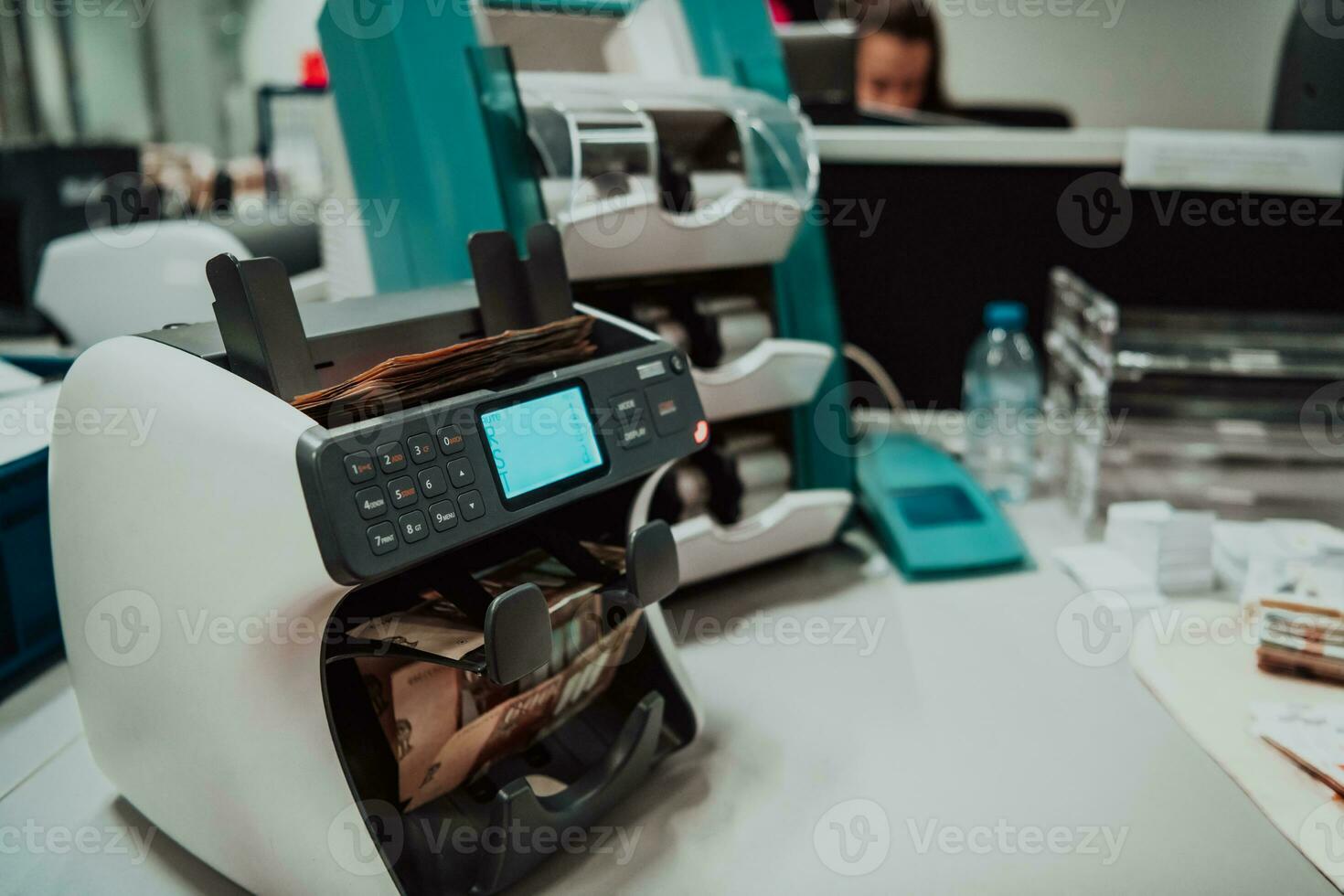 Sorted banknotes placed on the table after it is counted on the electronic money counting machine photo