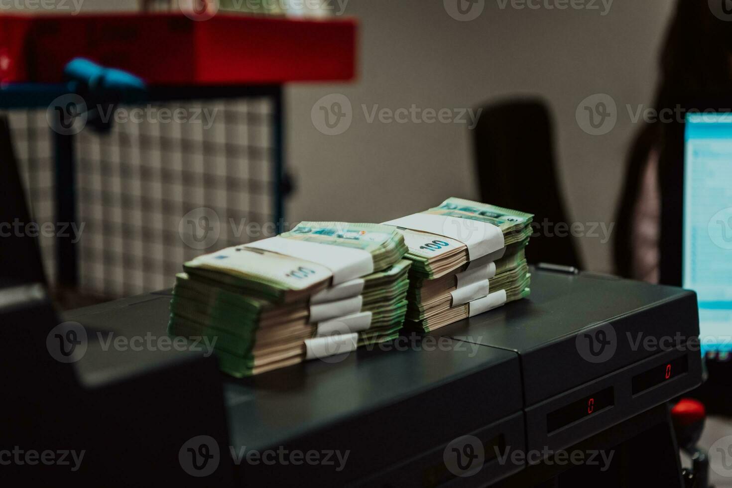 Sorted banknotes placed on the table after it is counted on the electronic money counting machine photo