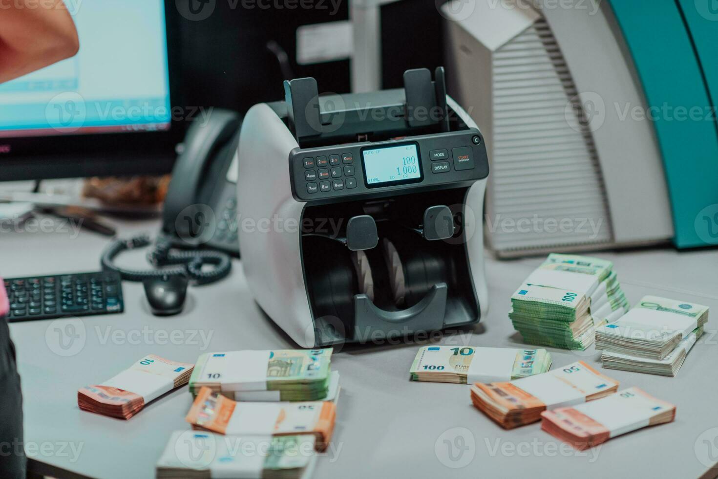 Sorted banknotes placed on the table after it is counted on the electronic money counting machine photo