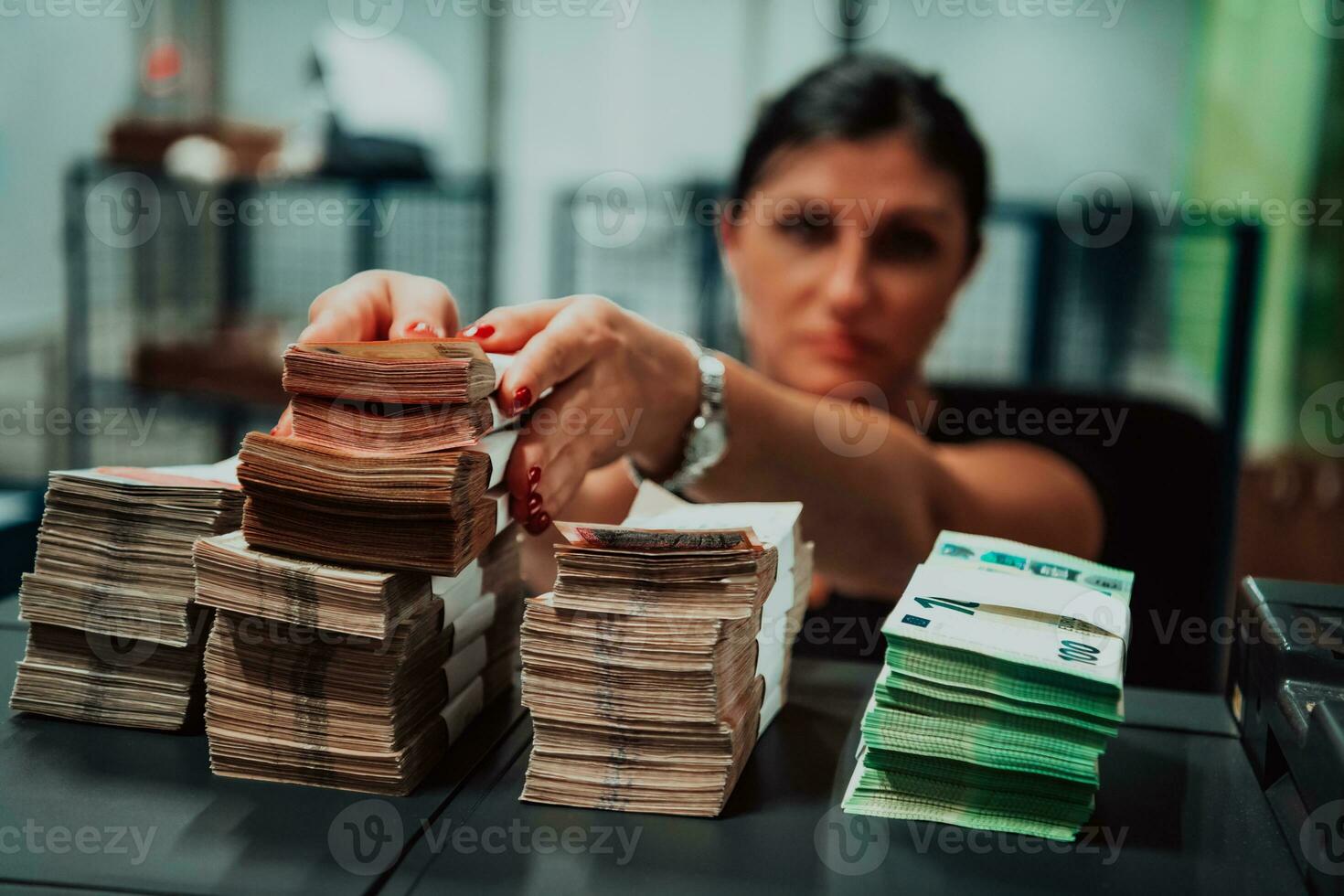 Sorted banknotes placed on the table after it is counted on the electronic money counting machine photo