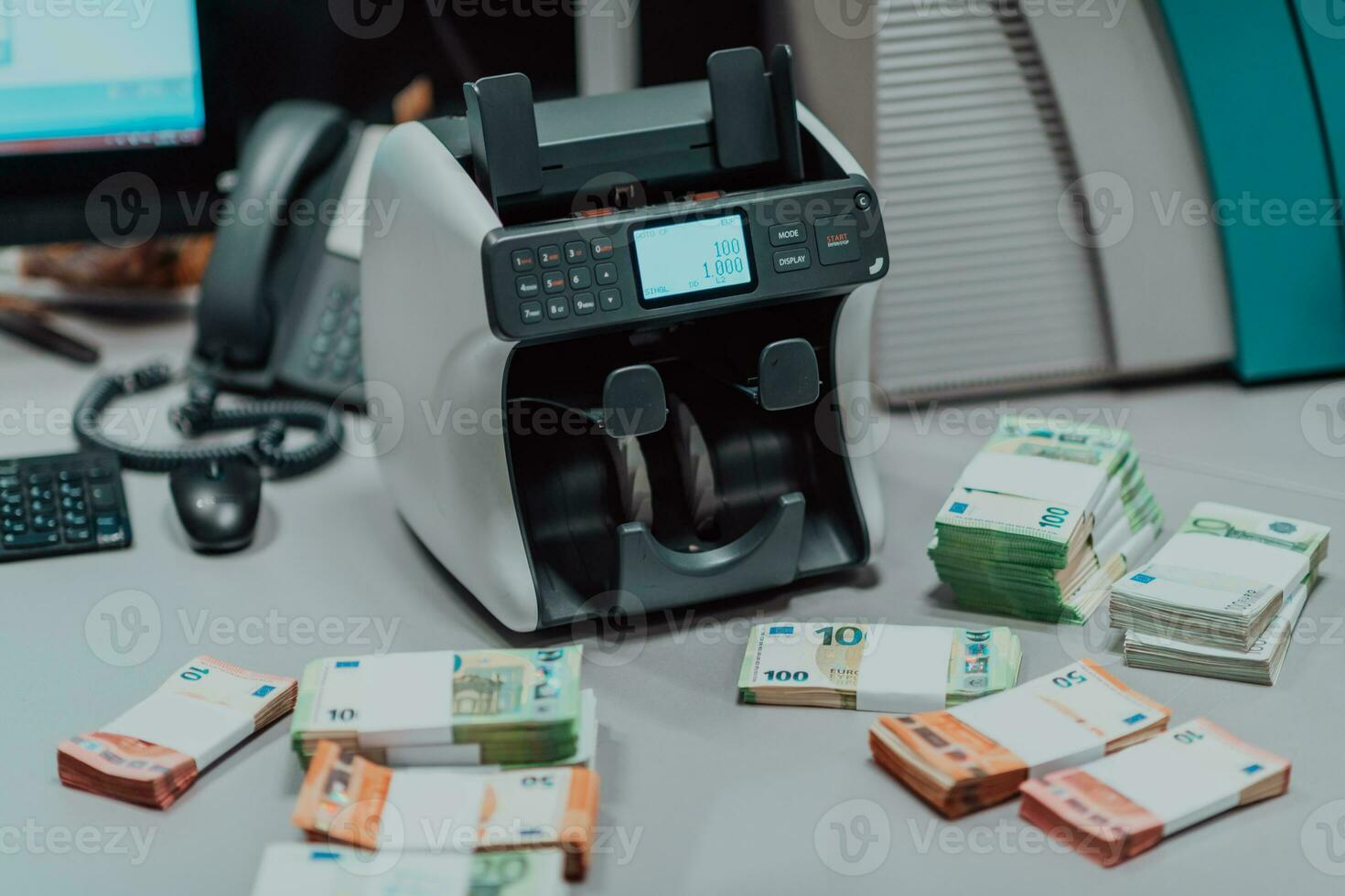 Sorted banknotes placed on the table after it is counted on the electronic money counting machine photo