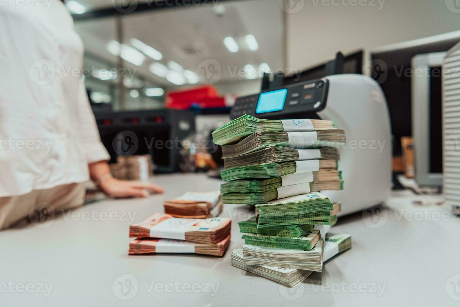 Sorted banknotes placed on the table after it is counted on the electronic money counting machine photo