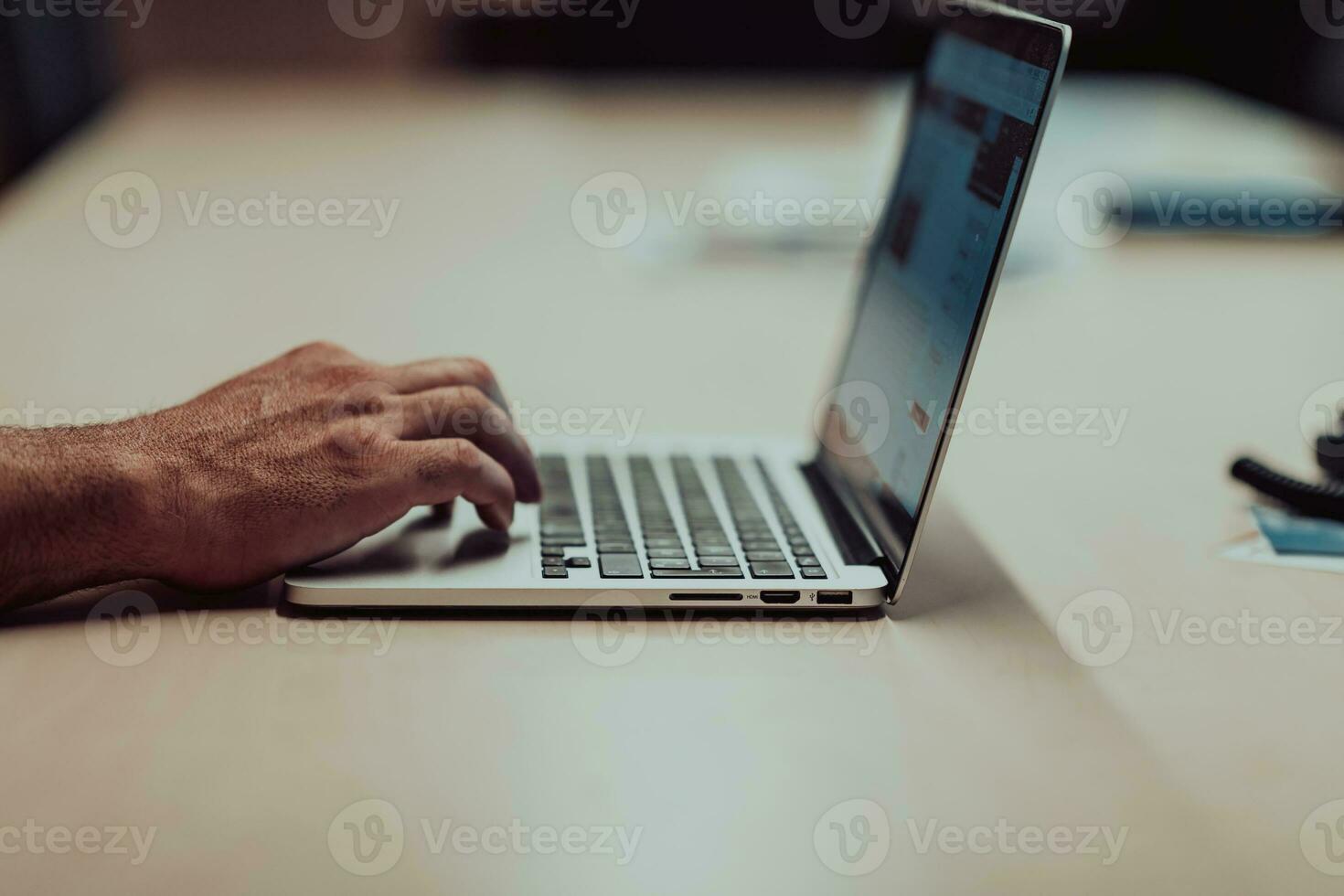 business man hand working on blank screen laptop computer on wooden desk as concept with social media diagram photo