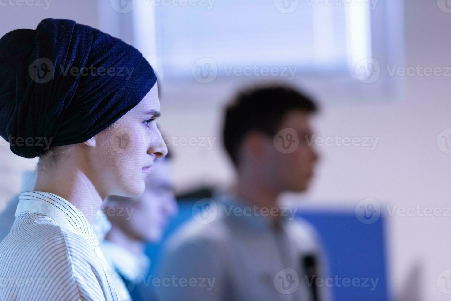 Muslim businesswoman giving presentations at conference room photo