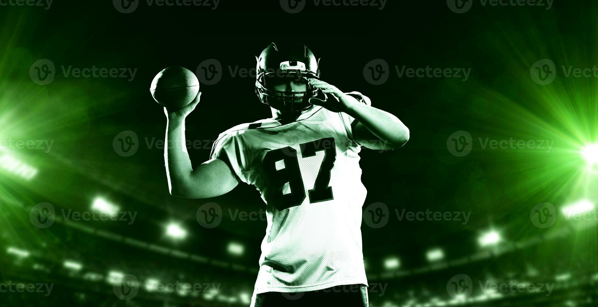 american football player throwing rugby ball photo