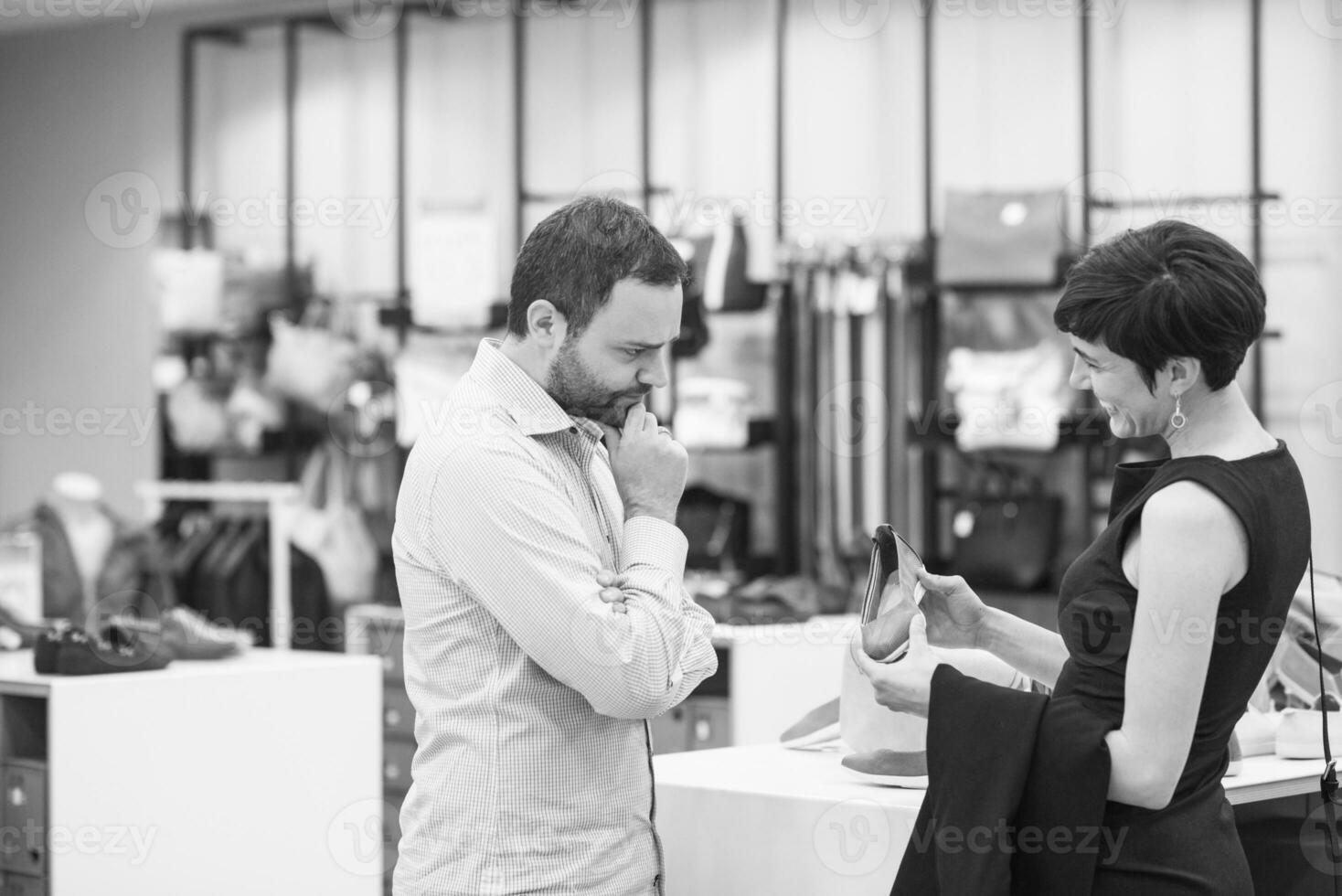 couple chooses shoes At Shoe Store photo